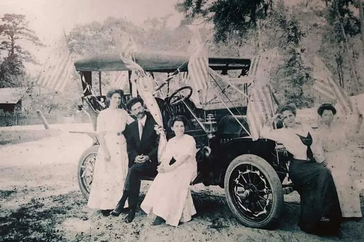 Early 1900s: J.L. “Deed” Smith with one of the first cars in Covington. His sister, Annie, stands at far right. H.J. Smith’s Son held franchises for Brush, Flanders, and Jackson autos.